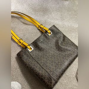 Calvin Klein Monogramed Tote with yellow accents